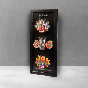 Angled view of the Framed Traditional Wooden Masks