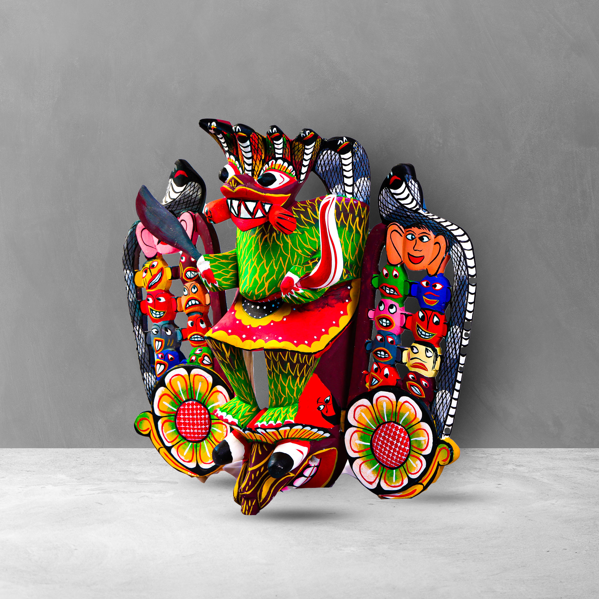 Side view of a hand carved Traditional 18 Sanni Mask showing demons