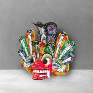 Angled view of a hand carved Traditional Naga Mask