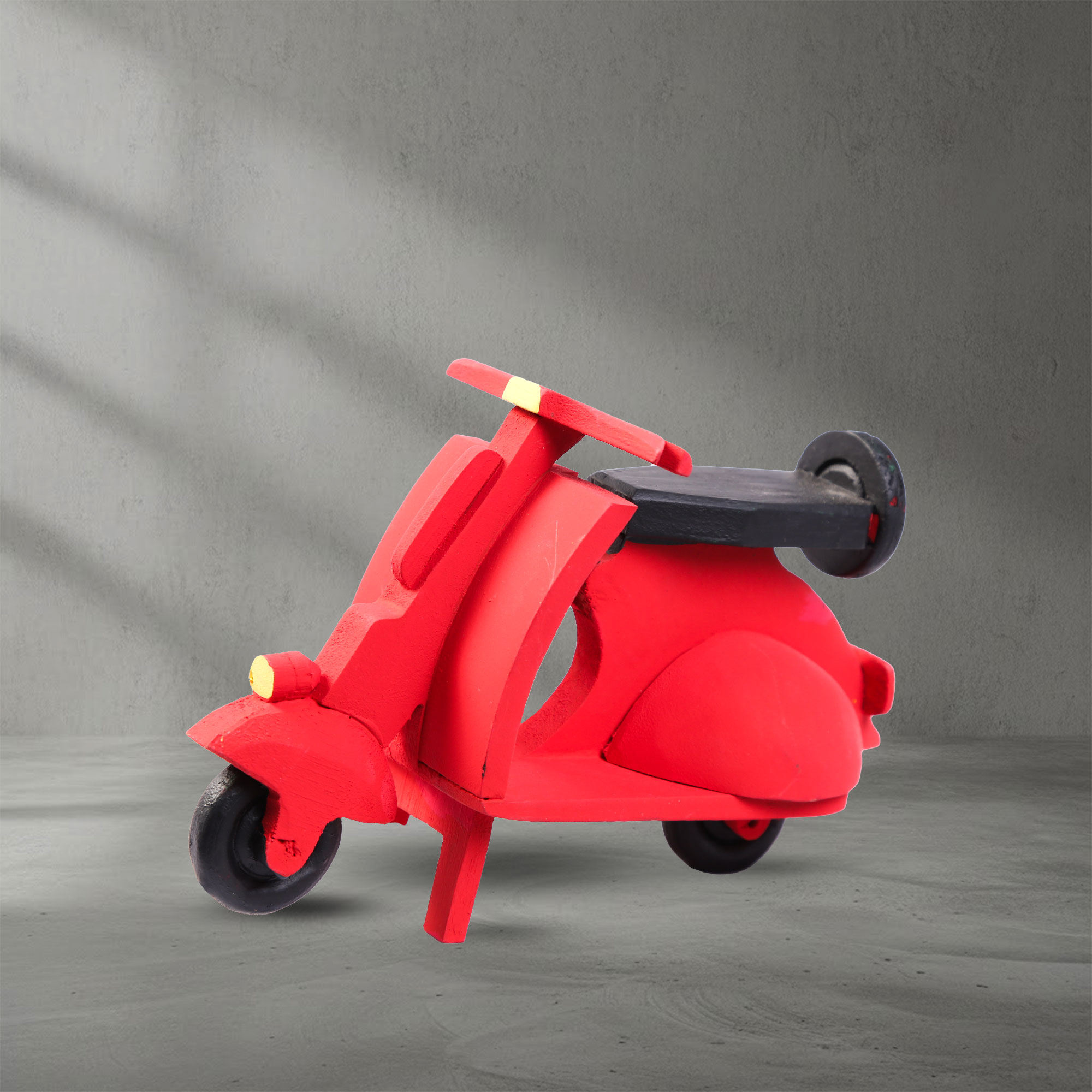 Angled view of a hand-carved and hand painted wooden scooter