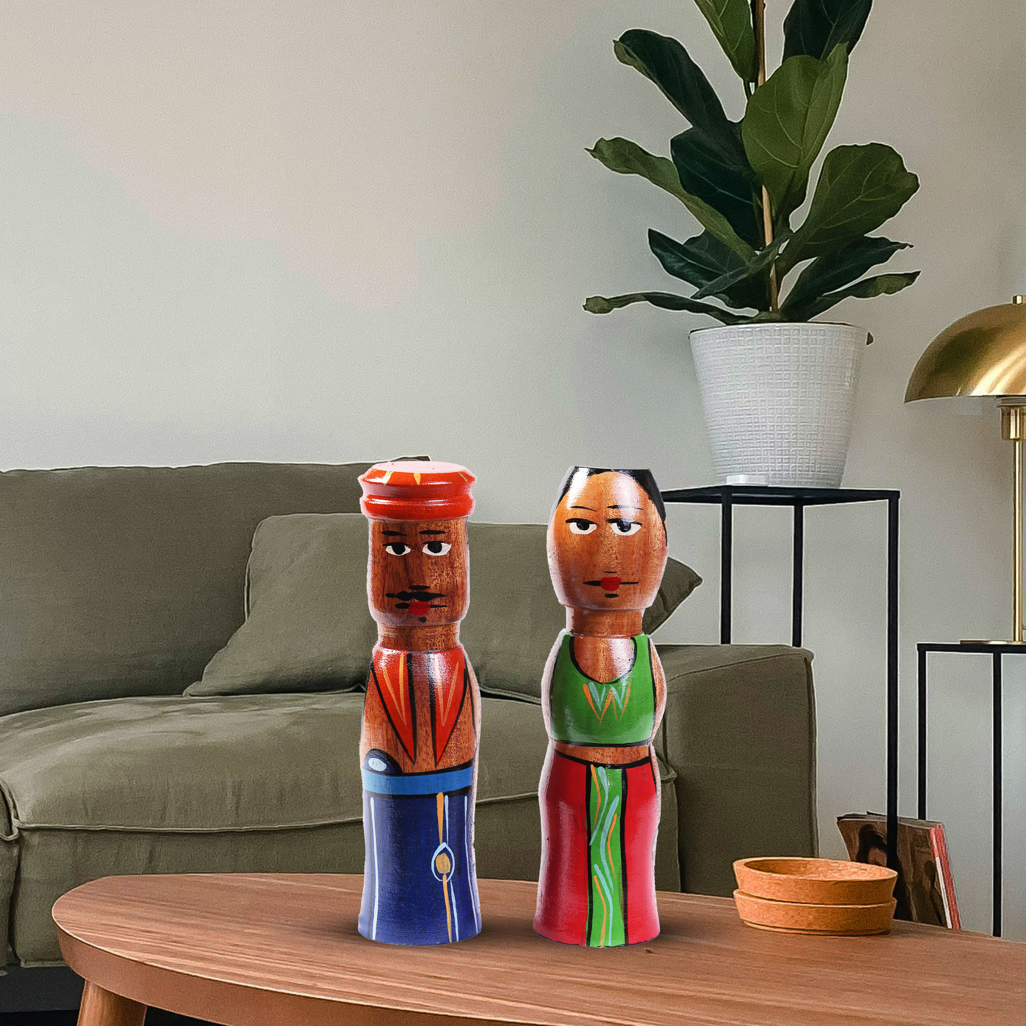 A Sri Lankan Wooden Skittle Couple displayed on a coffee table