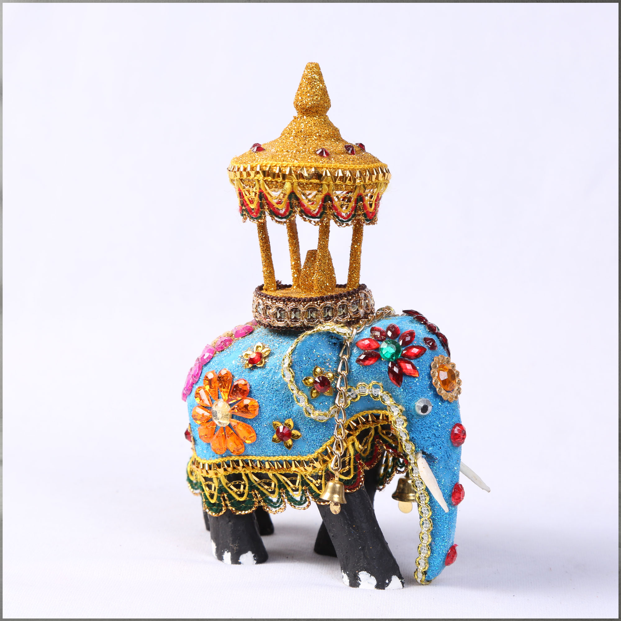 Angled view of a Wooden Decorated Elephant with Casket